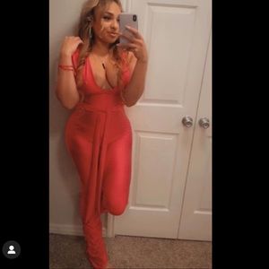 V cut hot pink romper scrunched bell bottoms.